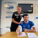 Derry man Joe McCready signs for Dungannon Swifts. Also pictured is manager Dean Shiels.
