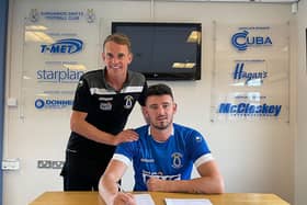 Derry man Joe McCready signs for Dungannon Swifts. Also pictured is manager Dean Shiels.