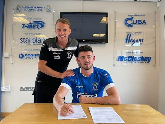 Derry man Joe McCready signs for Dungannon Swifts. Also pictured is manager Dean Shiels.