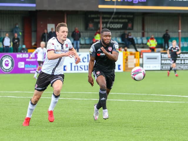 Derry City's James Akintunde races with Dundalk's Raivis Jurkovskis during the first half at Oriel Park. Photographs by Kevin Moore.