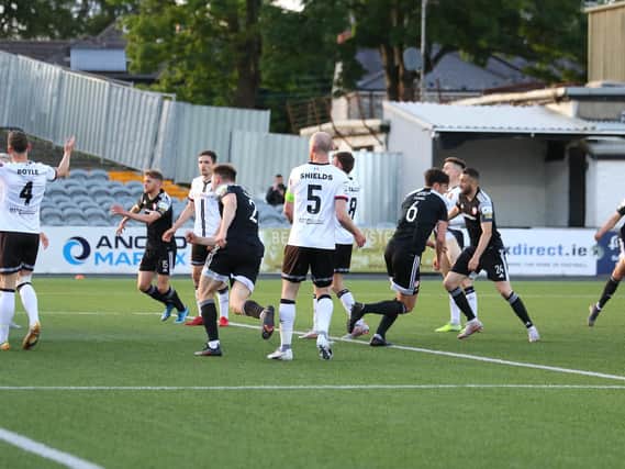 Eoin Toal races away to celebrate his second half goal at Oriel Park. Photograph by Kevin Moore.