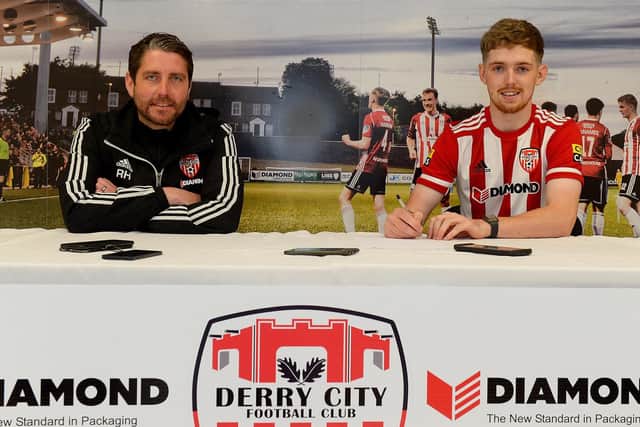 Derry City manager Ruaidhri Higgins and new signing Jamie McGonigle after the striker completed his move from Crusaders on a three and a half year deal. Photograph by George Sweeney.