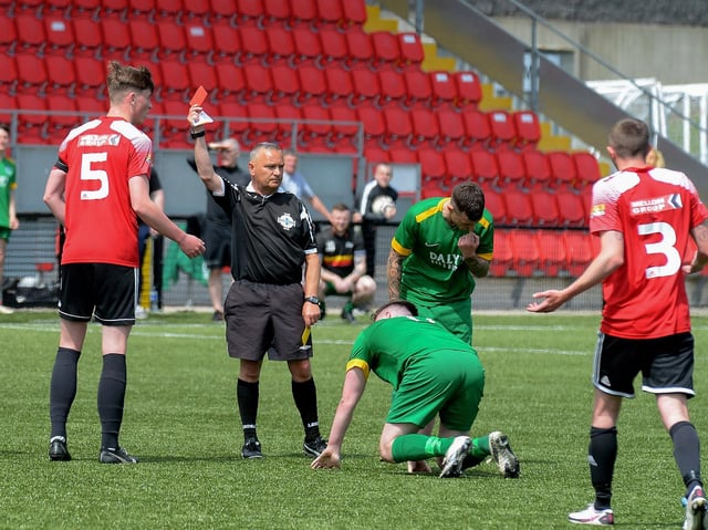 Referee Paul Doherty shows Maiden City’s Jamie Robinson during the first half of the centenary McAlinden Cup Final on Sunday afternoon last. (Photo: George Sweeney). DER2126GS - 005