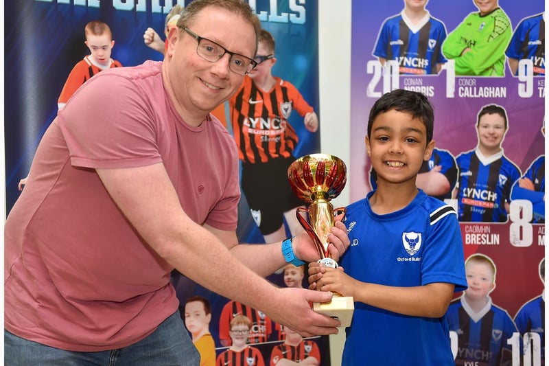 Joel Doherty receives the Coach Helper award for 2021 from James of Lynch’s Eurospar Trench Road.