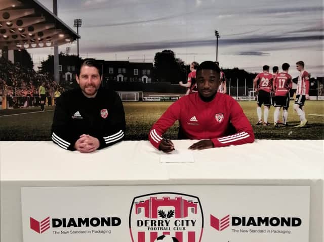 Junior Ogedi-Uzokwe pictured with Derry boss Ruaidhri Higgins as he completes his loan move from Dundalk