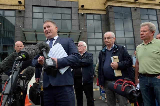 Solicitor Ciaran Shiels with Bloody Sunday relatives outside the City Hotel on Friday morning after the PPS announcement that Soldier F will not stand trial. Photo: George Sweeney / Derry Journal. DER2126GS – 161