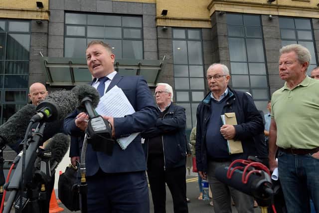 Solicitor Ciaran Shiels with Bloody Sunday relatives  outside the City Hotel on Friday morning after the PPS announcement that Soldier F will not stand trial. Photo: George Sweeney / Derry Journal.  DER2126GS – 161