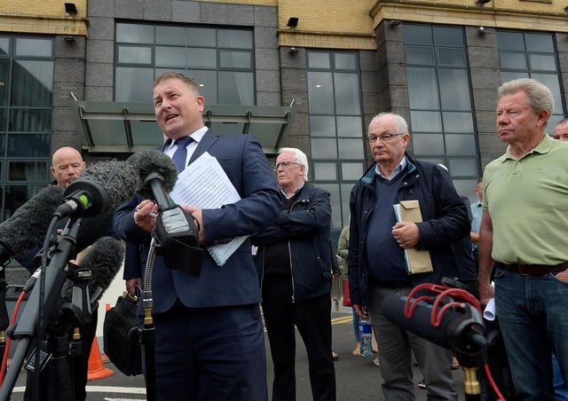 Solicitor Ciaran Shiels with Bloody Sunday relatives outside the City Hotel on Friday morning after the PPS announcement that Soldier F will not stand trial. Photo: George Sweeney / Derry Journal. DER2126GS – 161
