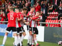 Eoin Toal celebrates with goalscorer Evan McLaughlin after his breakthrough strike in the first half. Photography by Kevin Moore.