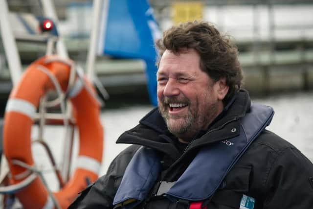 Michael enjoying himself on a speed boat