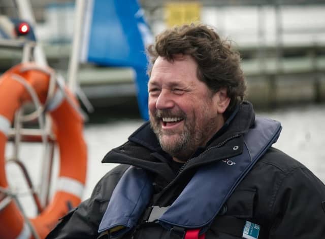 Michael enjoying himself on a speed boat