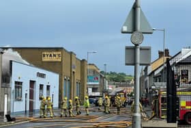 Firefighters tackling the blaze on Sunday. Picture posted by Daniel McCrossan MLA who owns a pub across the street.