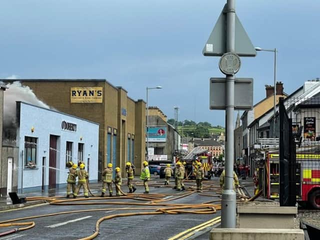Firefighters tackling the blaze on Sunday. Picture posted by Daniel McCrossan MLA who owns a pub across the street.