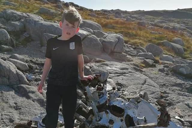 Shae with the wreckage of a Sunderland Bomber from World War Two on the slopes of Croaghmore.