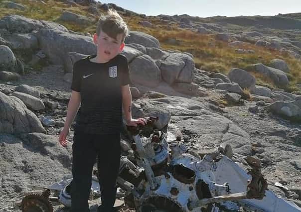 Shae with the wreckage of a Sunderland Bomber from World War Two on the slopes of Croaghmore.