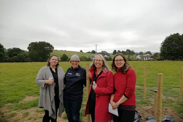 Di Harvey, with her daughters Stella Tamara and Petra, at the site outside Ballykelly where the Bristol Beaufort bomber crashed in April 1942.
