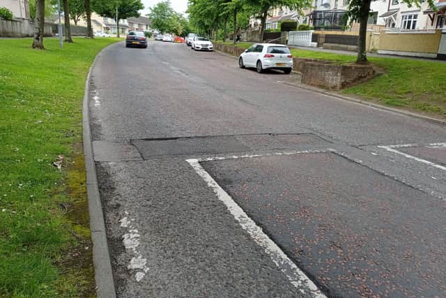 Road defects in the Carnhill area of Derry.