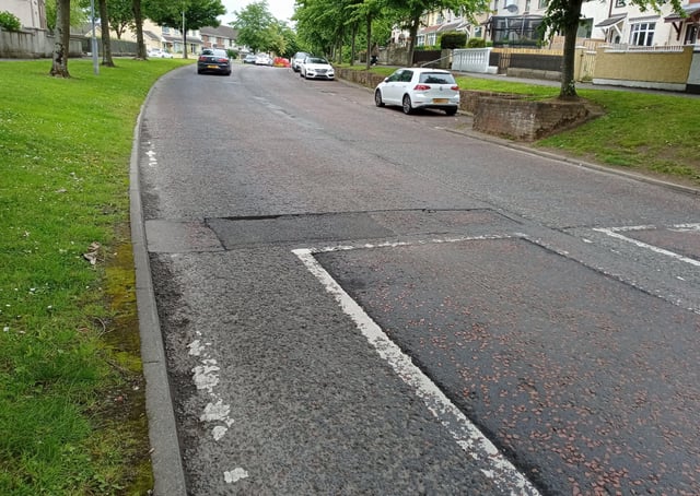Road defects in the Carnhill area of Derry.