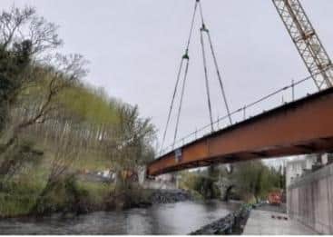 Beams being lifted in place for the Ardmore Road bridge.