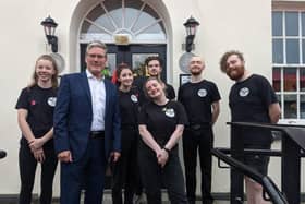 Labour leader Keir Starmer with staff from the Walled City Brewery.