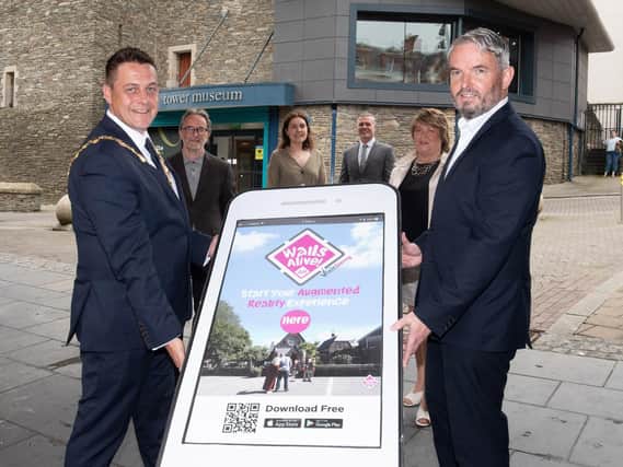 The Mayor Graeme Warke and Visit Derry manager Odhran Dunne launching the Walls Alive App.