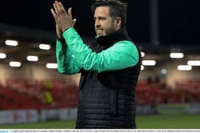 Rovers boss Stephen Bradley celebrates the win.