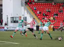 Derry sub, Jamie McGonigle attempts to get to this cross under pressure from Roberto Lopes and Liam Scales