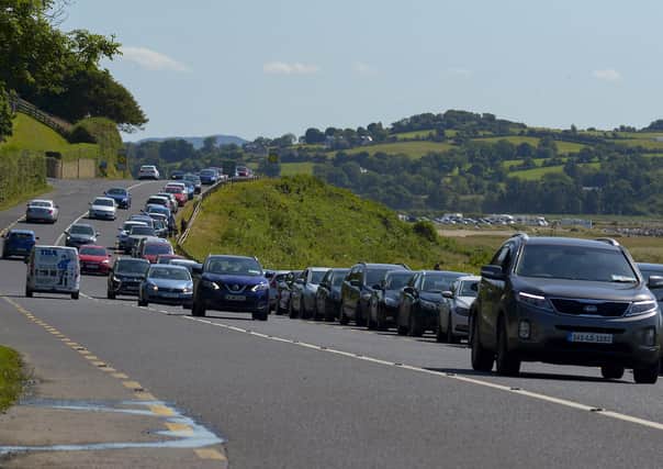 Cars parked along the main road at Lisfannon beach, on Saturday afternoon last, as  people flocked to beaches during the mini – heatwave. Photo: George Sweeney. DER2128GS – 046