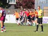 Evan McLaughlin is mobbed by his teammates after confidently converting the decisive fifth penalty in the shootout to see Derry City progress to the second round. Photographs by Kevin Moore.