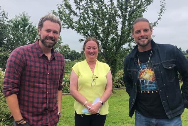 Keith Duffy from Boyzone and Bryan McFadden of Westlife fame prove a hit as they visited Foyle Hospice yesterday ahead of their concert at Ebrington Square on Sunday night. Pictured with Director of Nursing Bernie Michaelides.