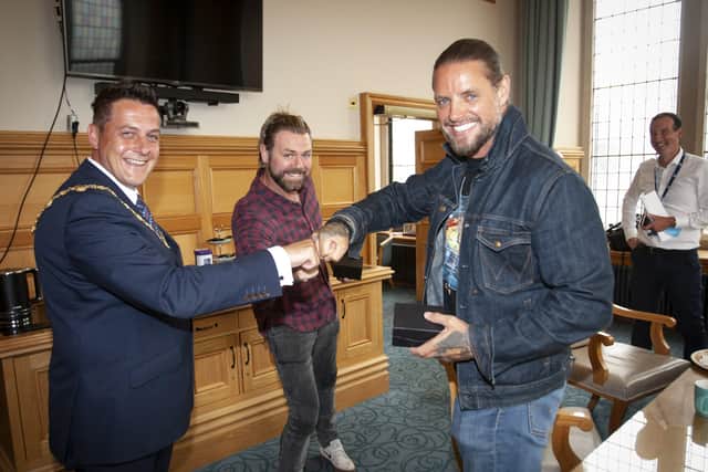 BOYZLIFE: Fist bumps all round after the Mayor, Alderman Graham Warke makes a special presentation to  Boyzone's Keith Duffy and Westlife's Brian McFadden at the Mayor's Parlour, Guildhall on Monday. (Photos: Jim McCafferty Photography)