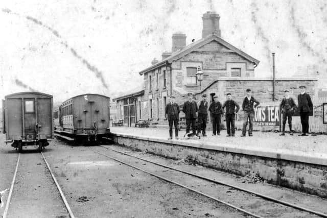 A group of railway staff on the platform of the station at Carndonagh in the early 1900s.