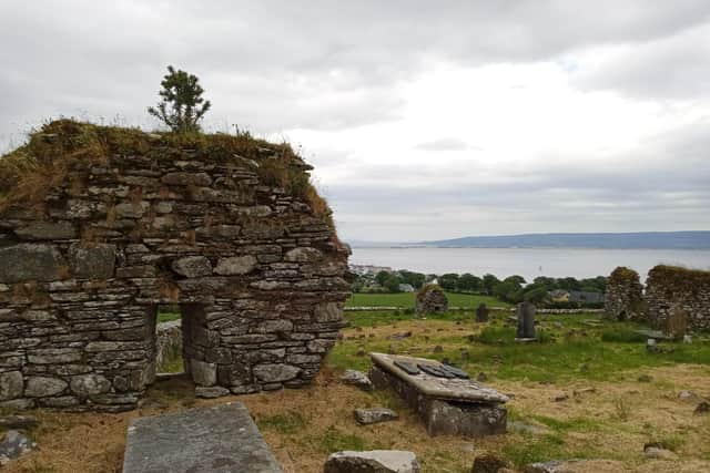 The site of an ancient monastery, cross and graveyard at Moville along the Wild Atlantic Way with the Causeway Coastal route in the background. Both routes are linked via Derry City. (Photo: Brendan McDaid)