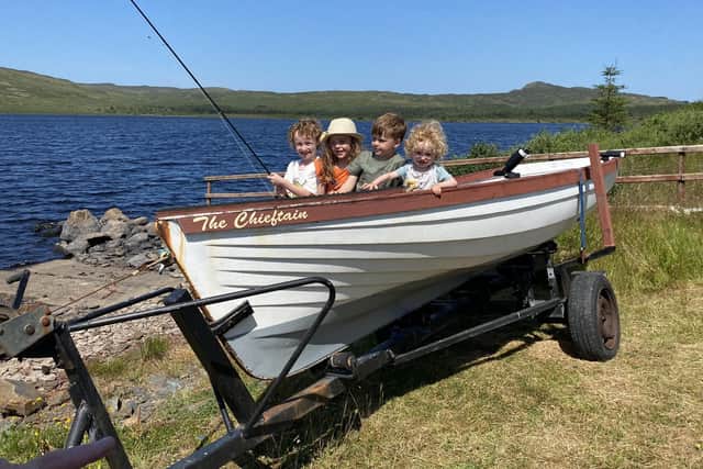 Martin’s grandchildren left to right:  Dualta,Sadhbh,Mairtin,Ruadán. This boat was at the competition  and Martin fished from this boat many times over the years at Loch Fern.