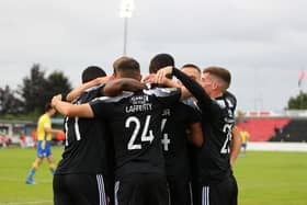 Derry City players celebrate in Longford after Danny Lafferty put them ahead in the first half. Photograph by Kevin Moore.