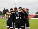 Derry City players celebrate in Longford after Danny Lafferty put them ahead in the first half. Photograph by Kevin Moore.