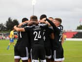 Derry City players celebrate in Longford after Danny Lafferty put them ahead in the first half. Photograph by Kevin Moore.