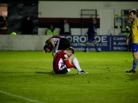 Derry City players drop to the floor after a hugely disappointing performance on the opening night of the season in Longford.