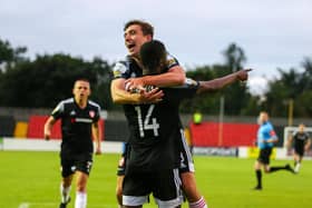 Joe Thomson celebrates with goalscorer Junior Ogedi-Uzokwe in Longford on Saturday night. Photograph by Kevin Moore.