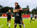 Joe Thomson celebrates with goalscorer Junior Ogedi-Uzokwe in Longford on Saturday night. Photograph by Kevin Moore.