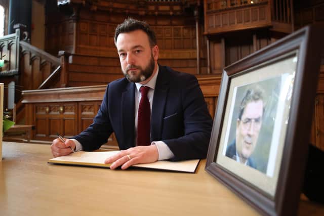 3rd August 2020 - SDLP leader Colum Eastwood signs the Book of Condolences for former Party Leader, MP, MEP and Nobel laureate John Hume.