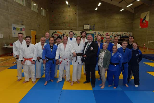 Jim Toland Senior Club Coach, LTYC Judo Club and Russell Brown, Vice-chair of the NU Judo Federation, present Roisin Doherty with an Honorary Black Belt, in recognition of her judo achievements. Included in the photograph are her parents Dermot and Caroline O'Hara and members of the Judo Club. LTYC Judo Club member Roisin Doherty who recently received an Honorary Black Belt from the NI Judo Federation, in recognition of her achievements pictured in training with LTYC Senior Judo coach Jim Toland. Photos: George Sweeney. DER2131GS – 036