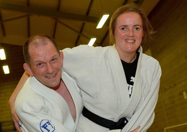 LTYC Judo Club member Roisin Doherty who recently received an Honorary Black Belt from the NI Judo Federation, in recognition of her achievements pictured in training with LTYC Senior Judo coach Jim Toland. Photos: George Sweeney. DER2131GS – 040