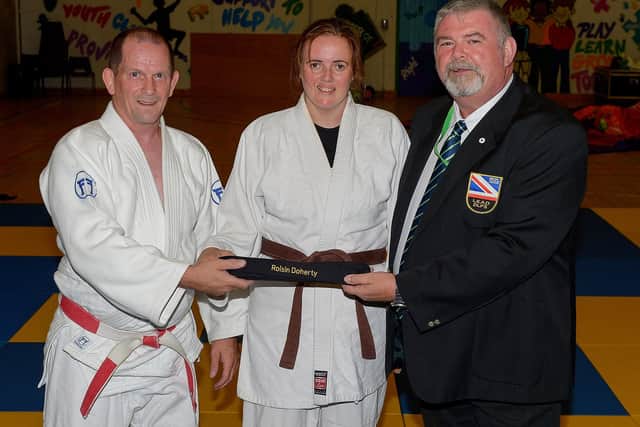 Jim Toland (left) Senior Club Coach, LTYC Judo Club and Russell Brown, Vice-chair of the NU Judo Federation, present Roisin Doherty with an Honorary Black Belt, earlier this week, in recognition of her judo achievements. DER2131GS – 035