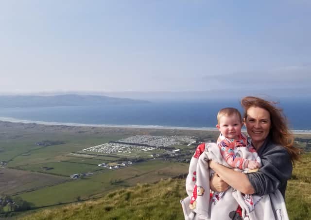 Caroline with her daughter Lúnasa during a trip to Binevenagh with Benone, Magilligan and Inishowen head in the background.