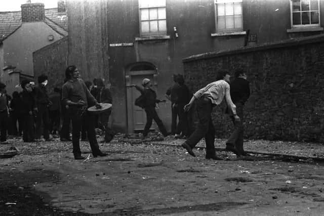 Young men throw stones at the RUC Barracks in Rosemount after 60 men were snatched from their beds on August 9, 1971.