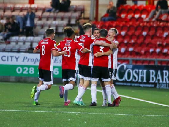Derry City players celebrate with goalscorer Danny Lafferty who netted a brace against Drogheda. Photograph by Kevin Moore.