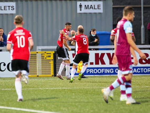 WHO'S THE MAN?  . . .  Ciaran Martyn (pictured watching on) would've been proud of that finish as Danny Lafferty bags his second of the match. Photograph by Kevin Moore.