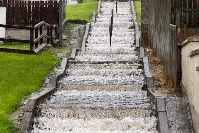 Surface water pours down steps in Strabane.