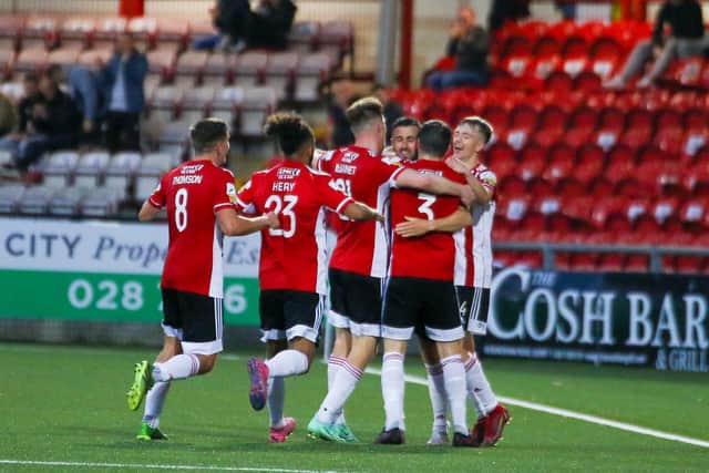 Danny Lafferty celebrates with his Derry City teammates after his second goal against Drogheda United on Friday night.